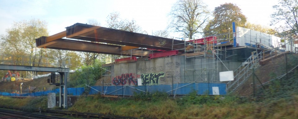 The main girders on their journey over the tracks