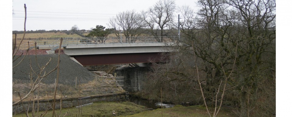 The new steel girder bridge on the old abutments
