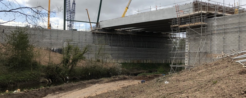 Precast concrete beams sat on concrete abutments