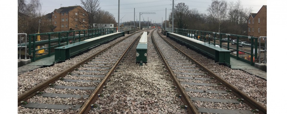 View across completed bridge showing reinforced top flanges of the main girders