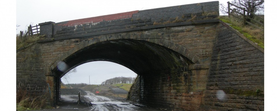 The existing masonry arch bridge
