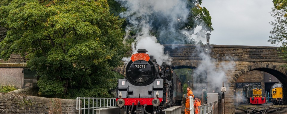 Steam train passing over UB27