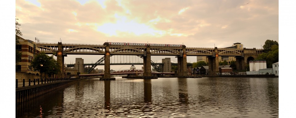 A glorious view looking up the River Tyne at the bridge at dusk