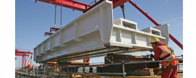 Another bridge section is loaded into place using the temporary gantry crane