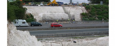 A cut into the embankment to build the abutments in