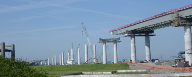 Gantries are erected atop the columns a step ahead of the deck