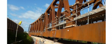 The bridge being moved into places on rollers