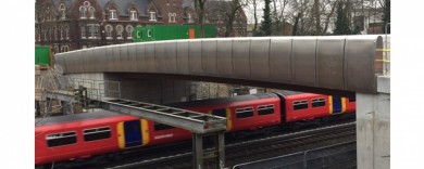 Parapets over electrified lines have strict design criteria to prevent the public climbing them