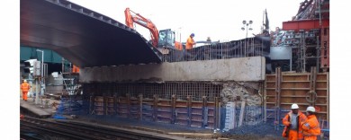 Half of the deck sitting on the abutment waiting for the second half to be plaed next to it